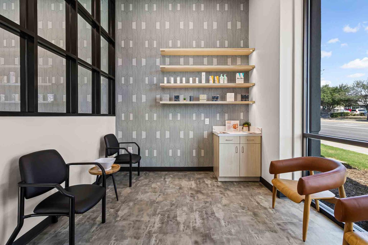 Bright office lobby in Austin with leather seating, a coffee table and daylight from one side