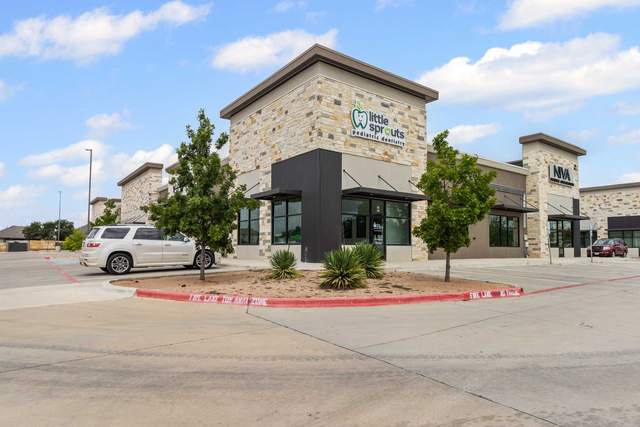 Retail storefront in West Austin with a stone facade, awnings and parking in front