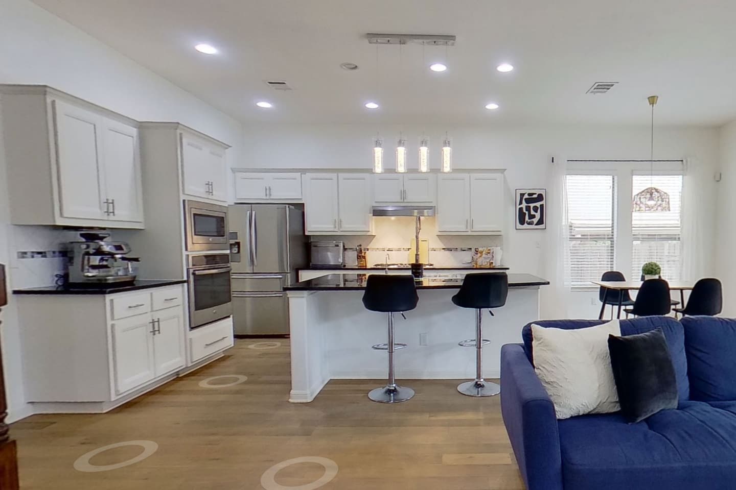 Open plan kitchen and living area in Leander captured for a Matterport three dimensional walkthrough