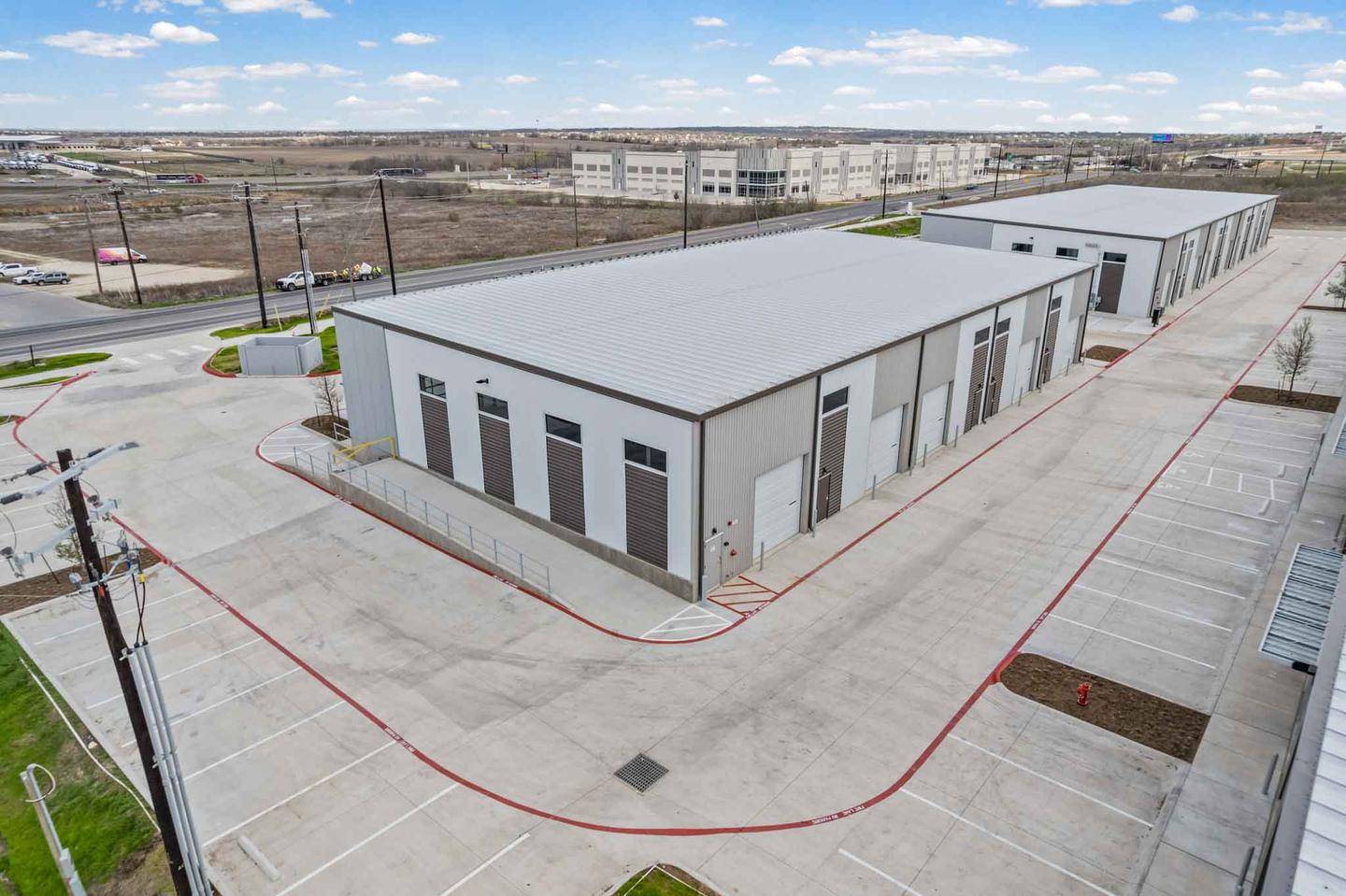 Aerial view of a new build commercial development in Kyle with the site still being finished