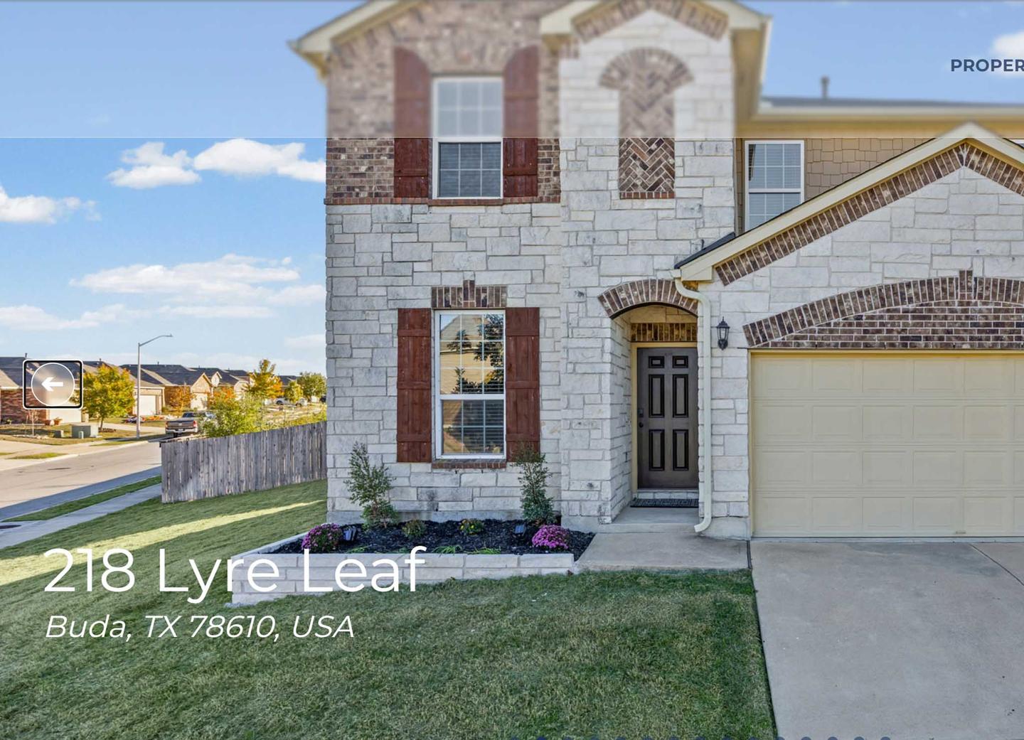 Single property website showing a listing exterior with the address overlaid